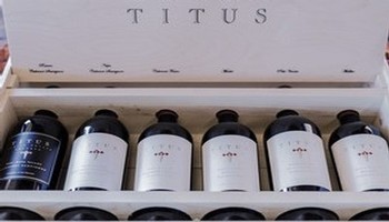 Titus Bottles Lined Up in Box
